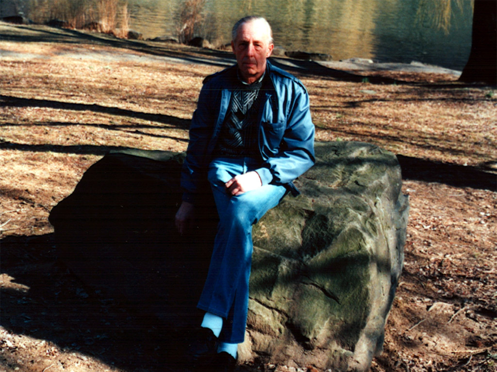 Dad sitting on the rock
