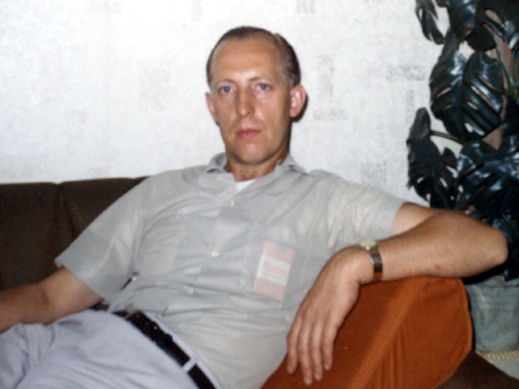 dad laying on couch 60s